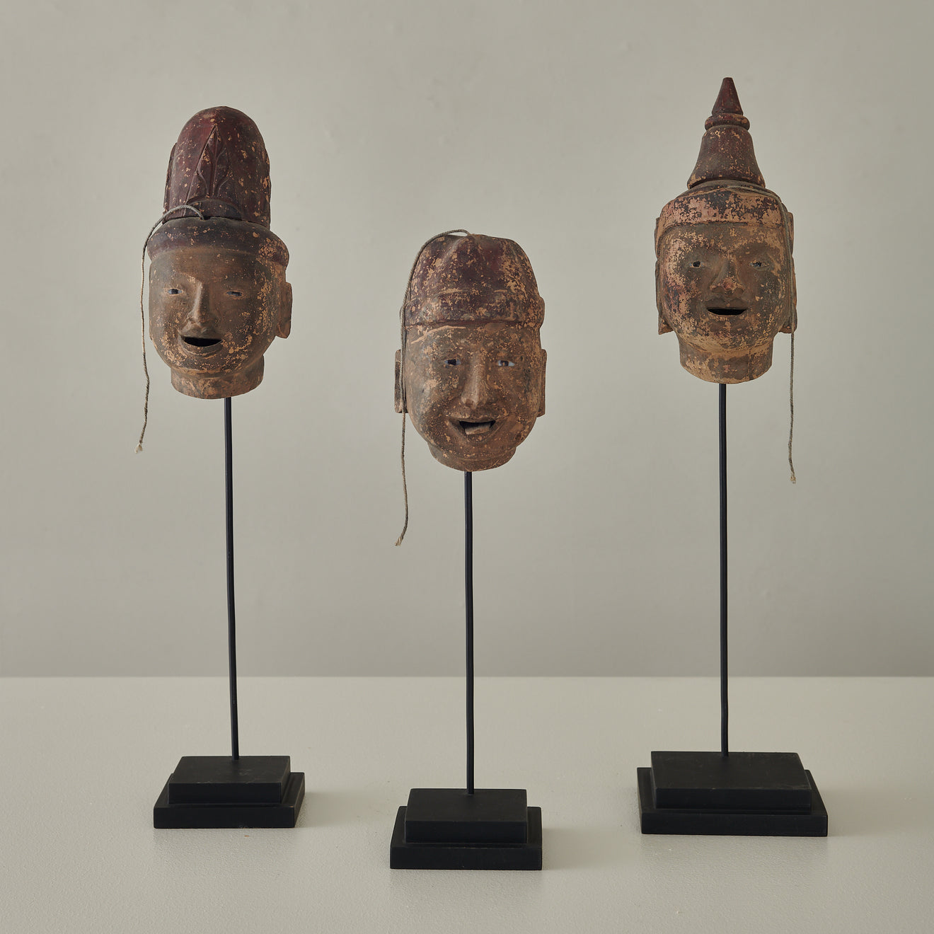 COLLECTION OF 3 ARTICULATED WOOD PUPPET HEADS ON STANDS